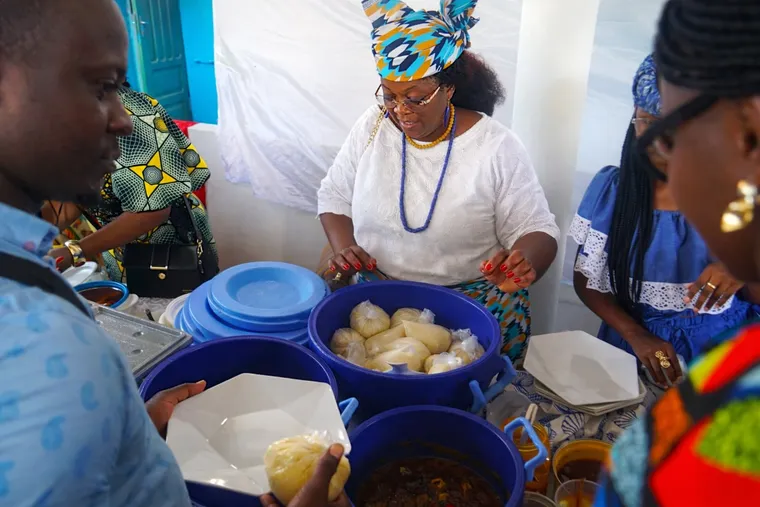 A staff member serves a hot meal at the BRIF canteen.