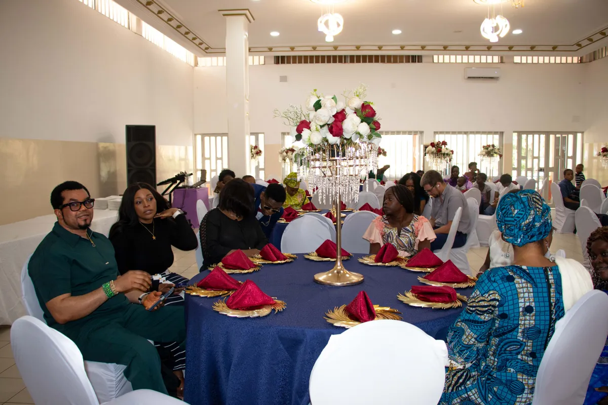 Parents and staff seated together at a BRIF school event.